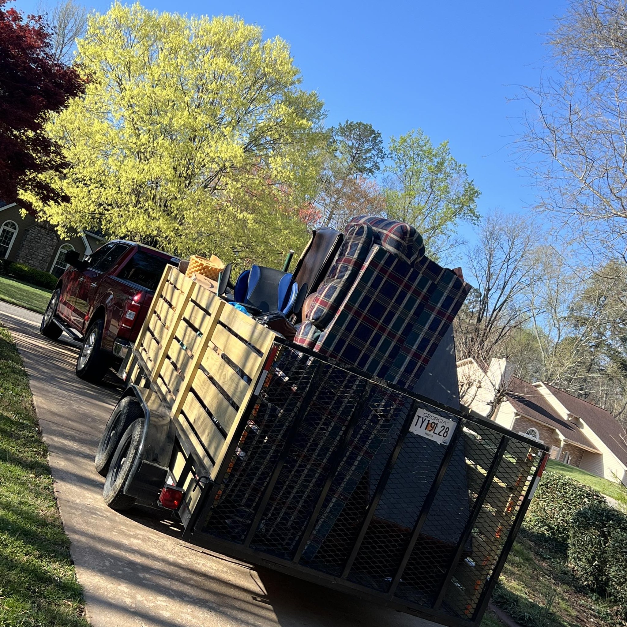 Brison Culpepper's truck loaded with a happy customer's junk